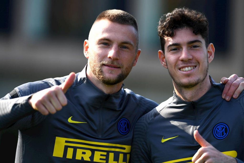 skriniar-bastoni-real