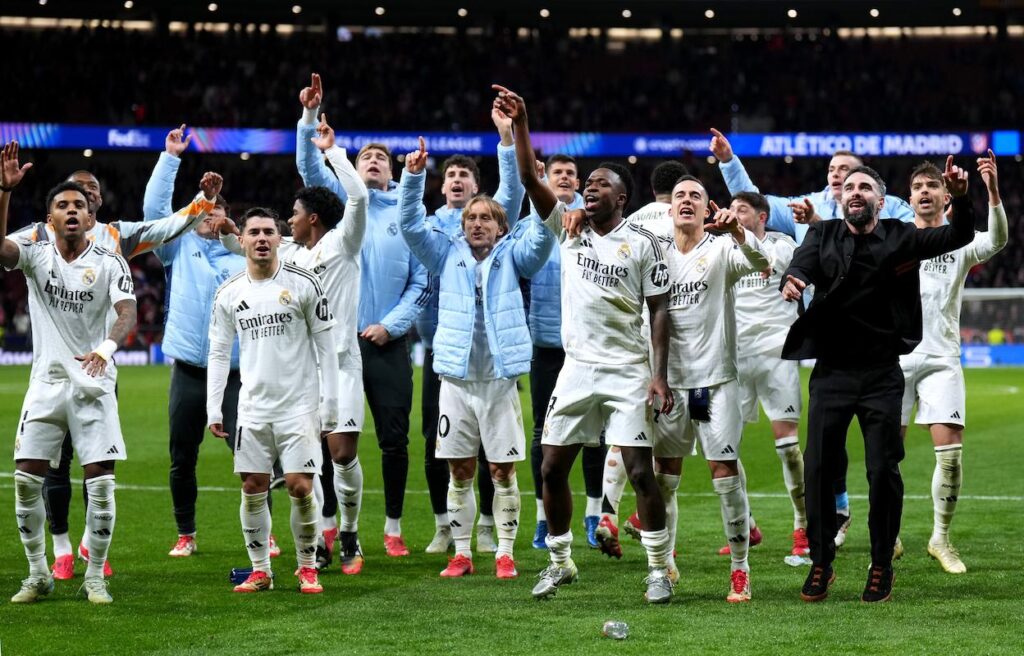 Players of Real Madrid celebrate victory after defeating Atletico de Madrid